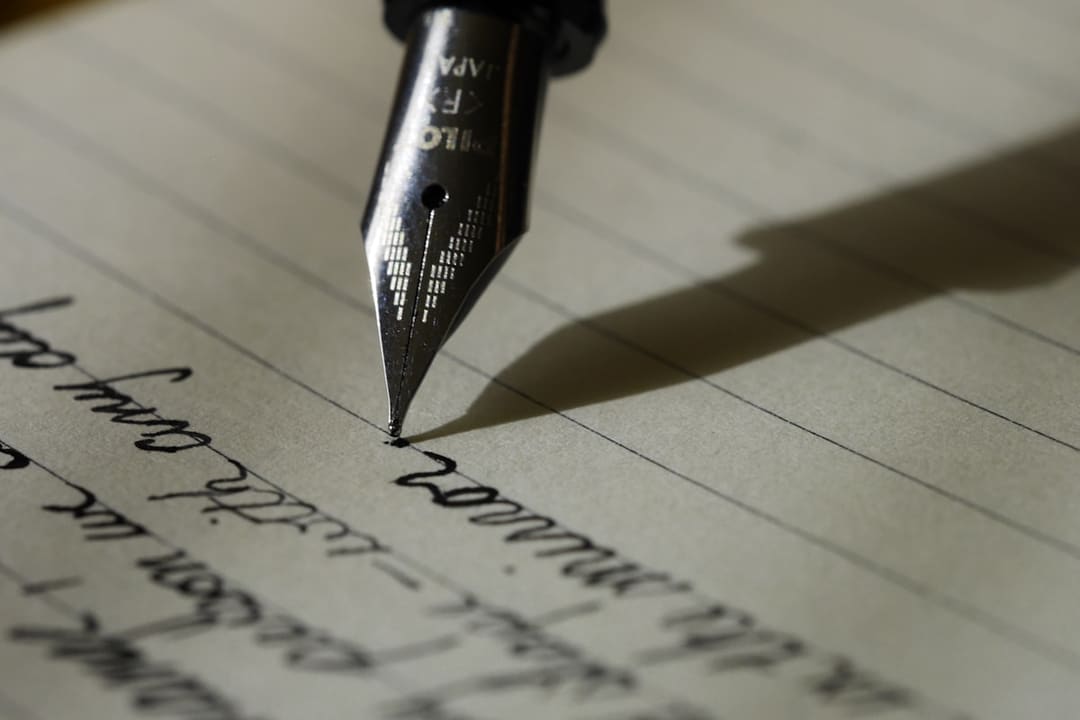 Red pen marking corrections and edits on a printed paper document.